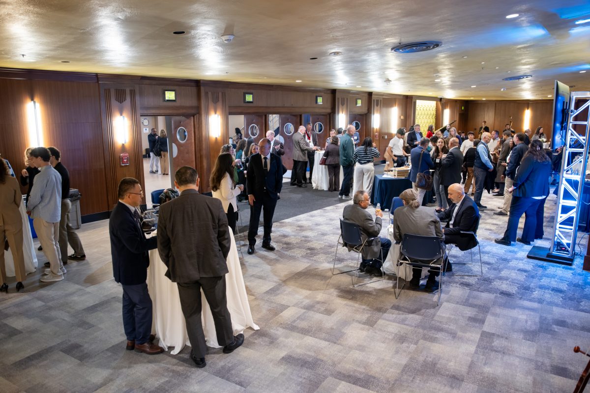 Images of people at the main lobby of the Jorgeson. They appear to be talking amongs each other.
