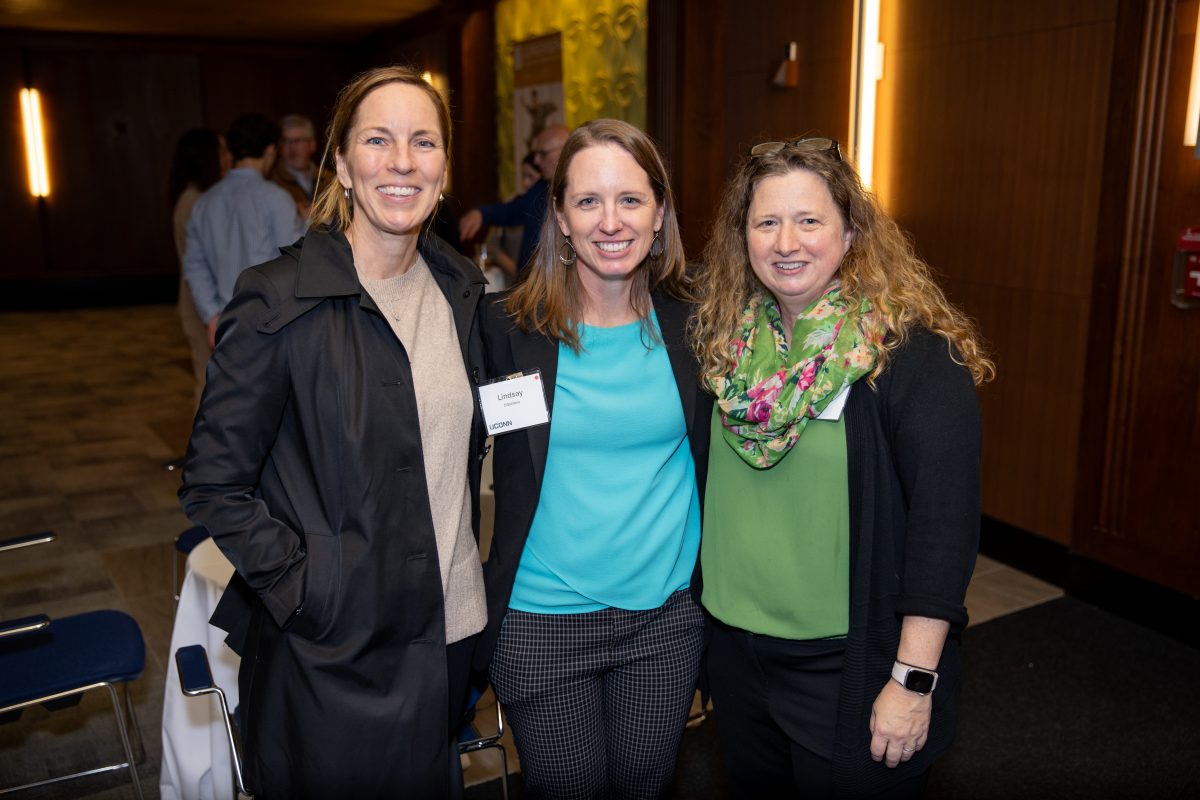 Three ladies posing for a picture.